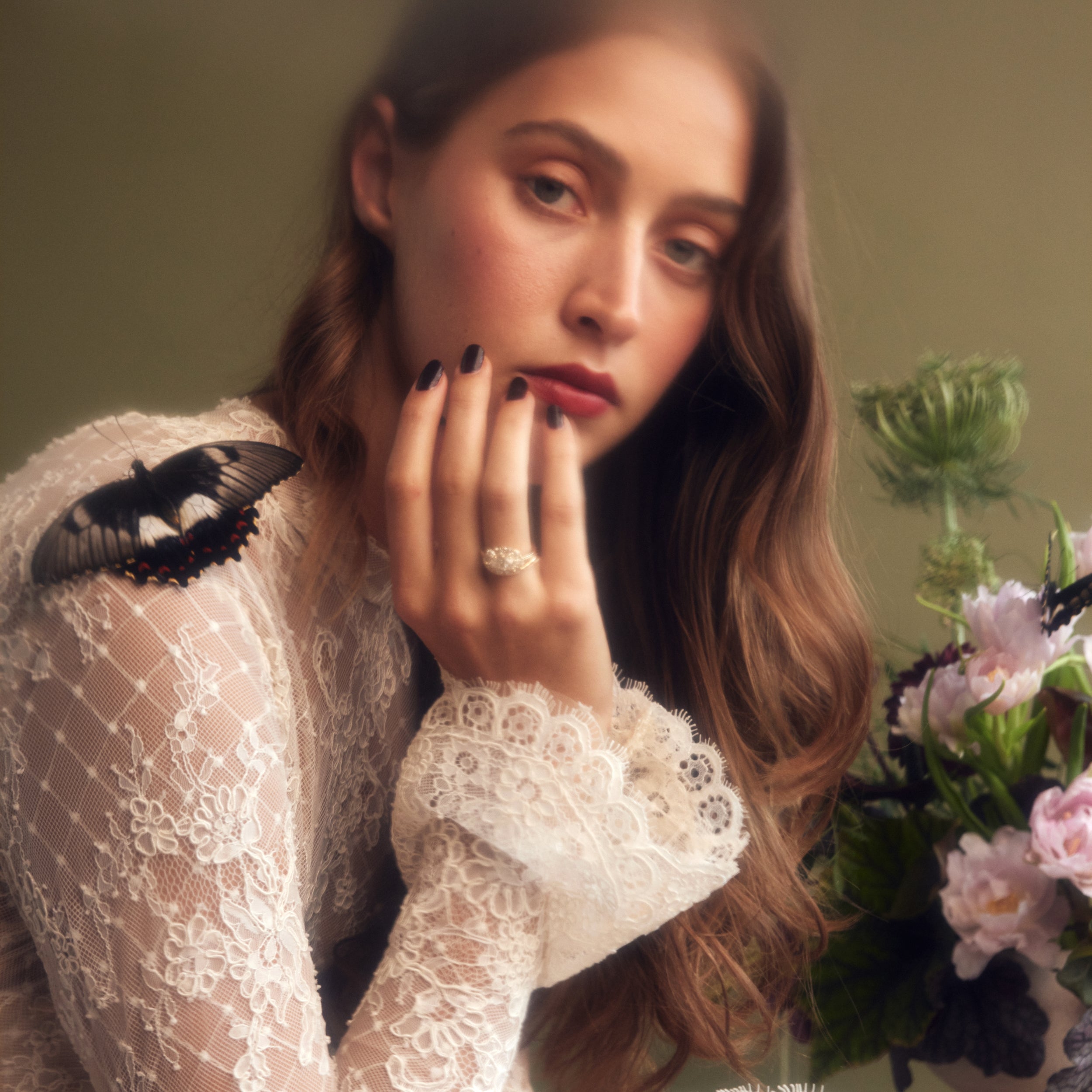 Moissanite engagement rings antique cluster oval on bride with butterfly